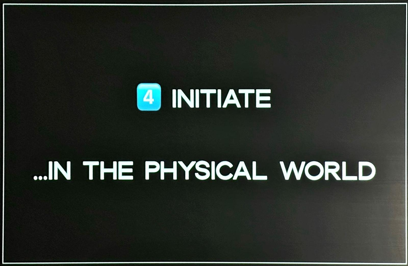 A black sign with white text</p>
<p>Description automatically generated