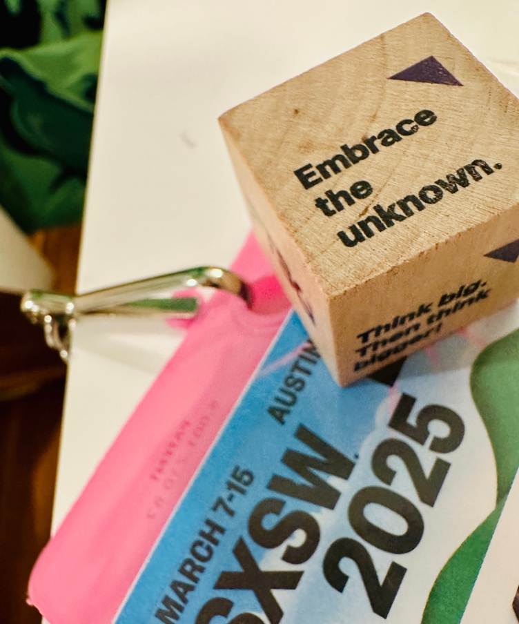 A wooden block with writing on it</p>
<p>Description automatically generated